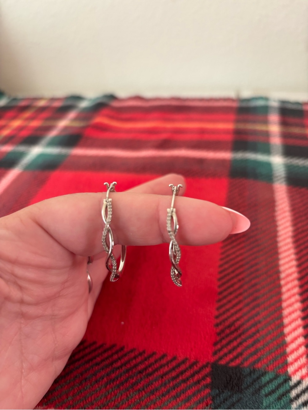 925 Sterling Silver Twisted Hoop Earrings with .25 ct of diamonds.